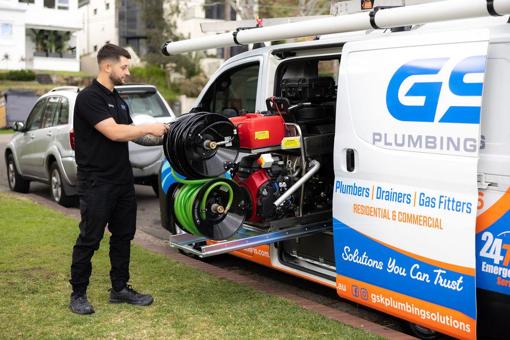 GSK Plumbing Solutions plumber repairing a burst pipe in Sydney