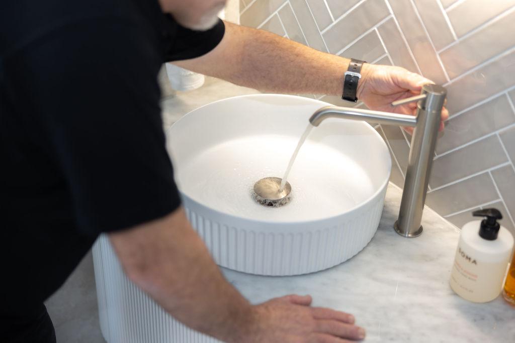 GSK Plumbing Solutions plumber fixing a household water leak in Sydney