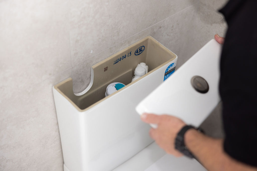 GSK Plumbing Solutions plumber repairing a blocked toilet in Sydney